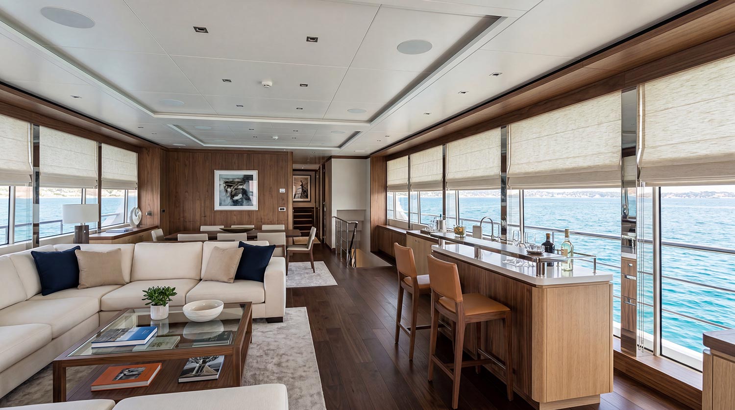 Modern luxury yacht salon with wooden floors and ceiling speakers
